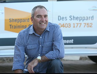 Des Sheppard, owner of Sheppard Training Group, in front of his branded vehicle